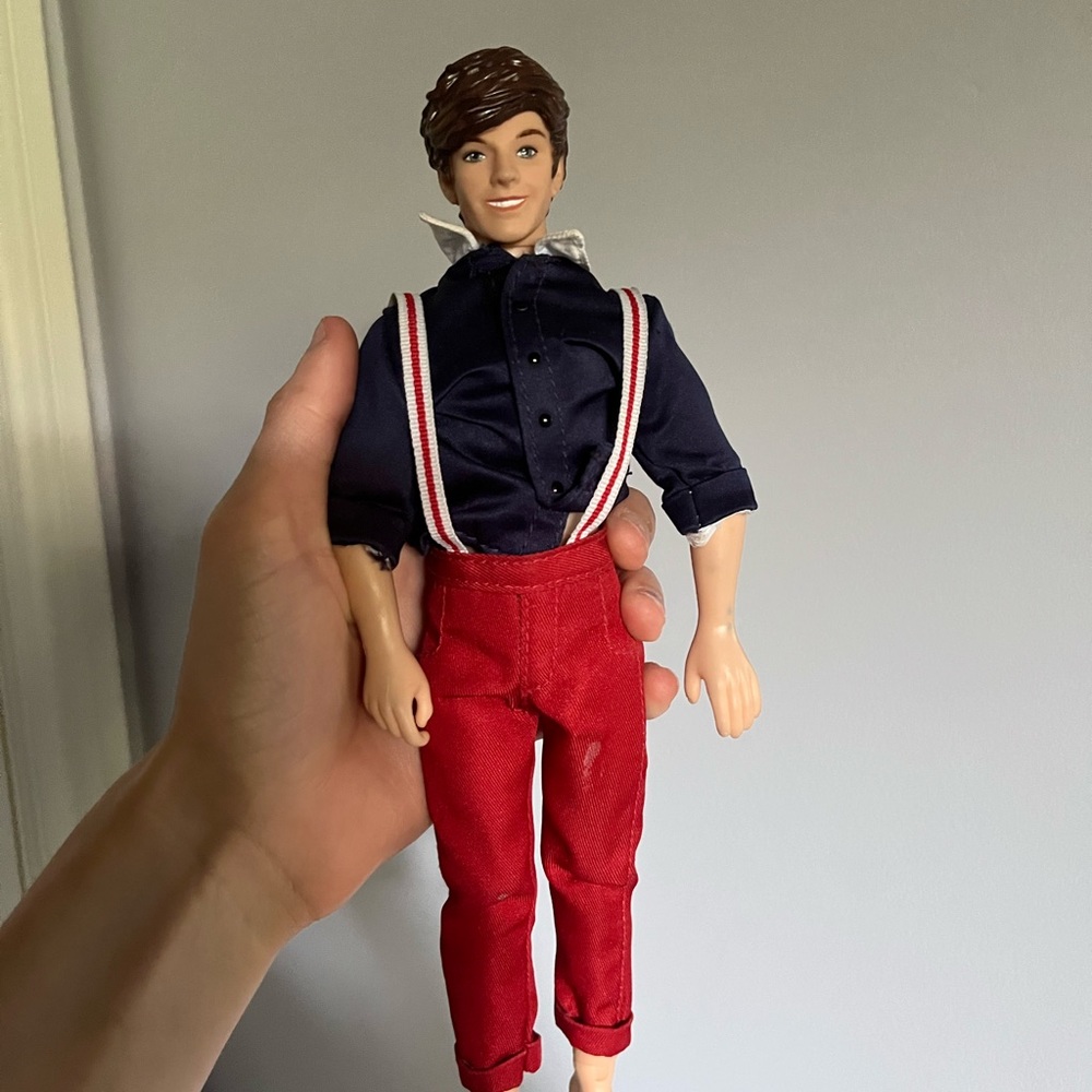 One direction singing Louis doll